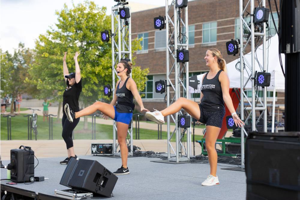 Zumba instructors on stage during Laker Kickoff